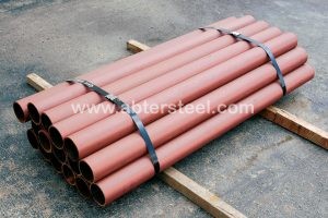 Steel pipe bollards painted with primer in bundle on skid